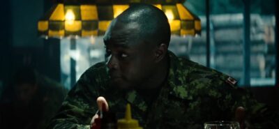 Man Of Steel :- Kwesi Ameyaw as Canadian Airman (Credit - DC Comics & Warner Bros)